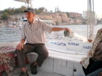 Jake tries his hand on the felucca rudder at Aswan